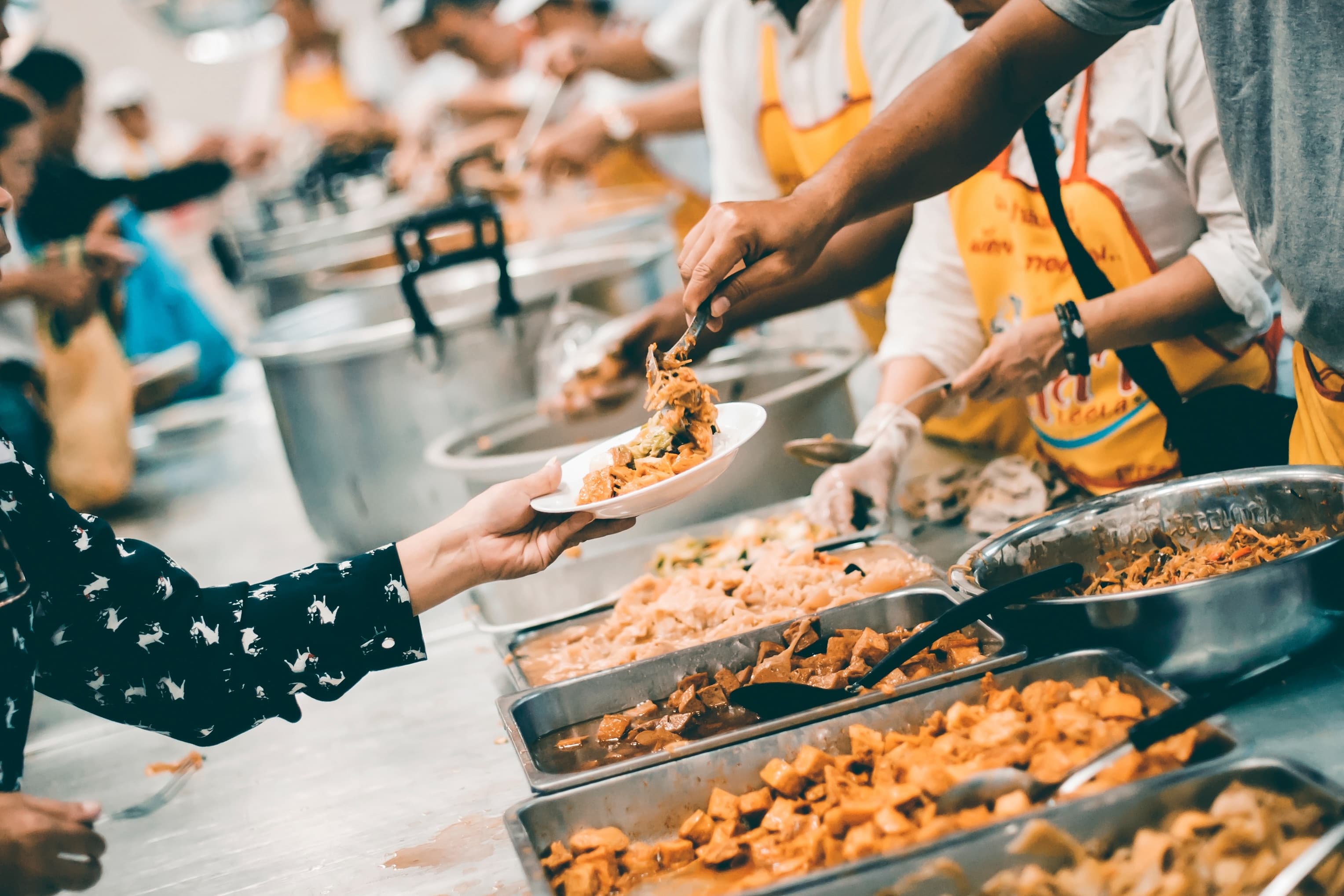 Volunteers meeting need — serving food relief to those in crisis